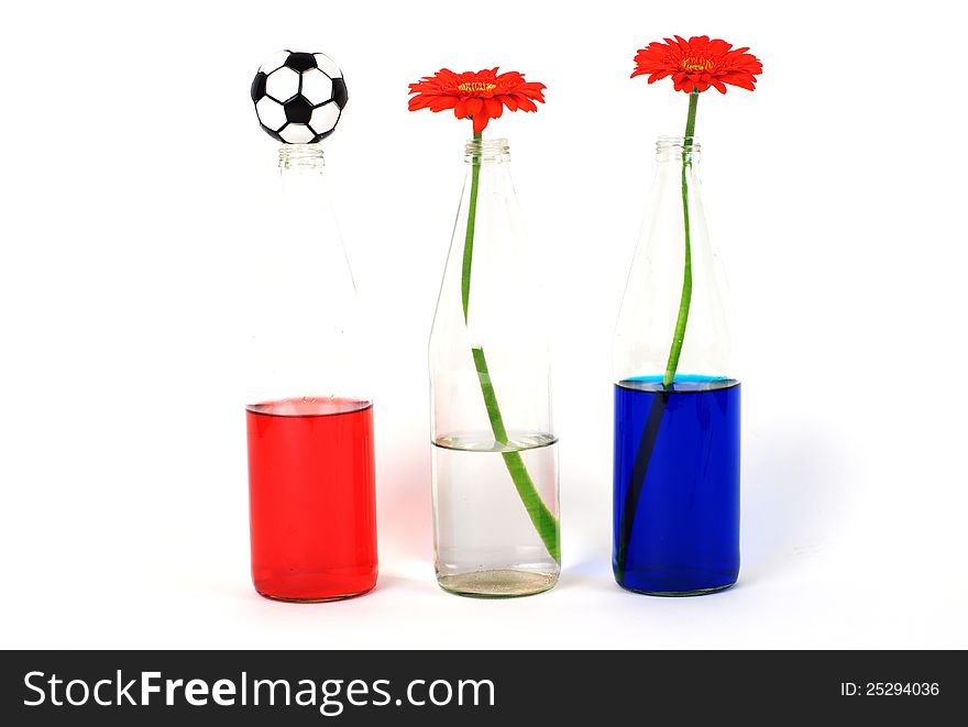 Dutch flag with coloured bottles and orange germini's and a football