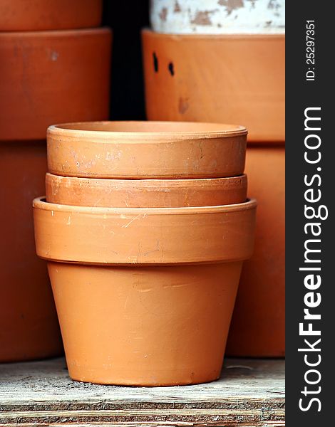 Three terra cotta pots, stacked. Three terra cotta pots, stacked.