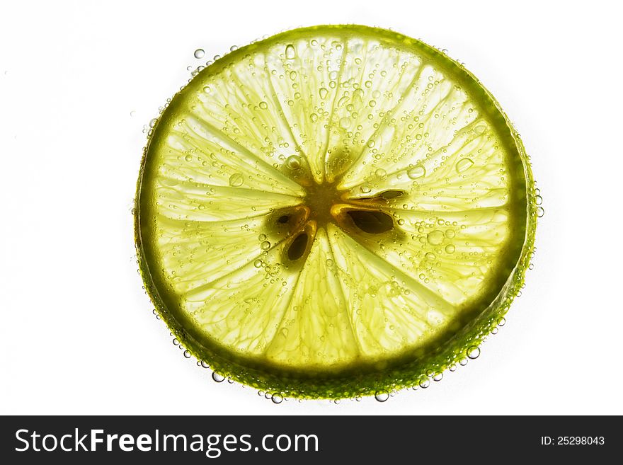 Lime Slice Floating In Soda Water