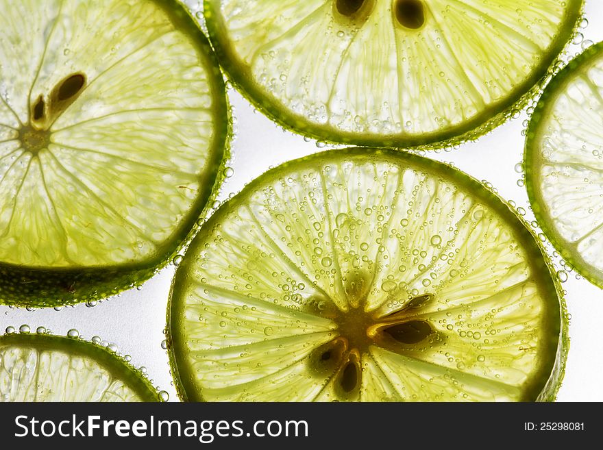 Lime slices floating in soda water