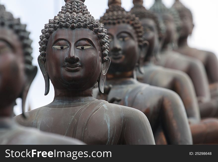 Statues of Buddha in a row