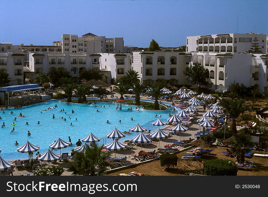 Summer time and some tunisian hotel with beautiful swimming pool