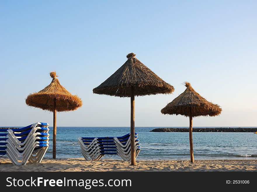 Evening at the beach with sunshades