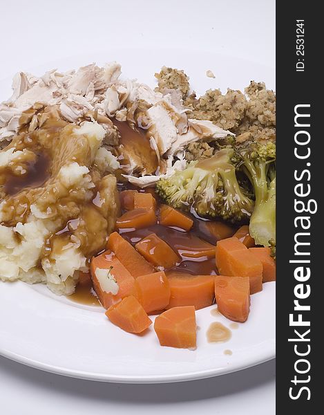 A roast dinner with chicken,carrots,brocolli and sage and onion stuffing. A roast dinner with chicken,carrots,brocolli and sage and onion stuffing