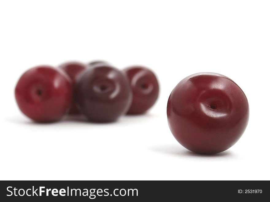 Red plums with white background