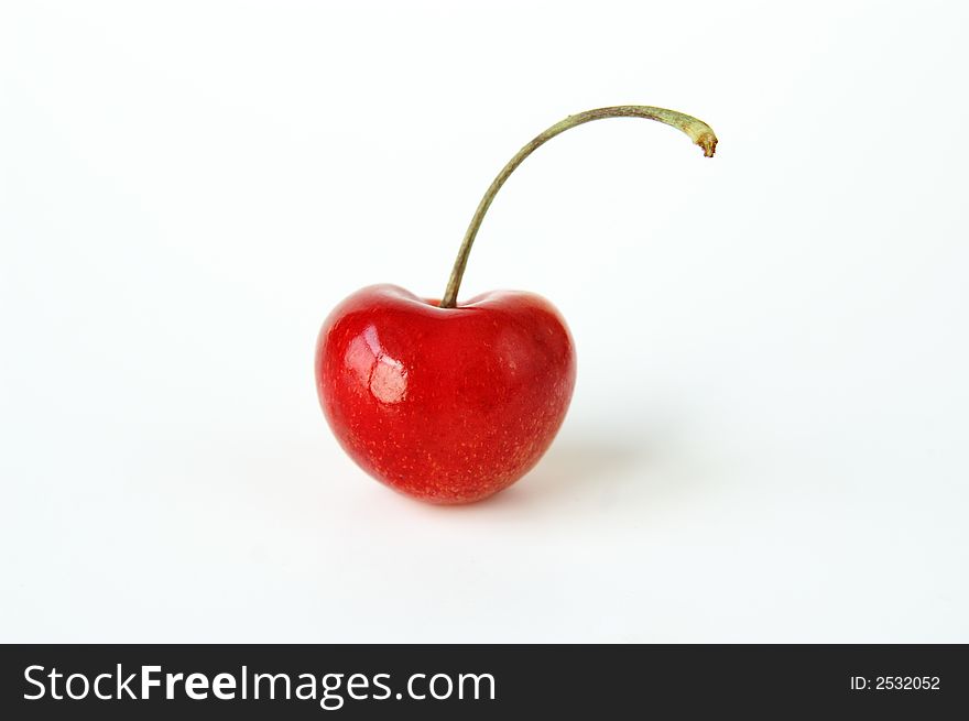 A still life of a single cherry