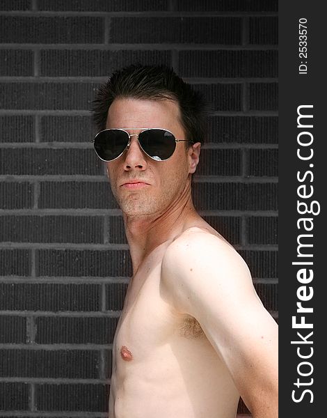 Adult male model portrait brick background