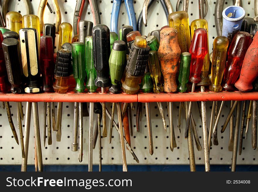 Large grouping, wide variety of colorful screwdrivers, old and new.