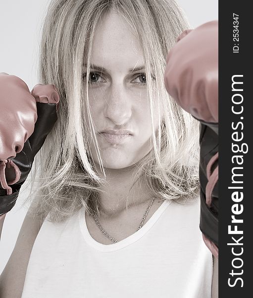 Blond female boxer with red boxing glowes