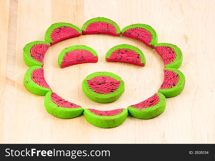 Fun with cookies.  Cookies dyed and cut to look like watermelon slices, made into a funny face. Fun with cookies.  Cookies dyed and cut to look like watermelon slices, made into a funny face.