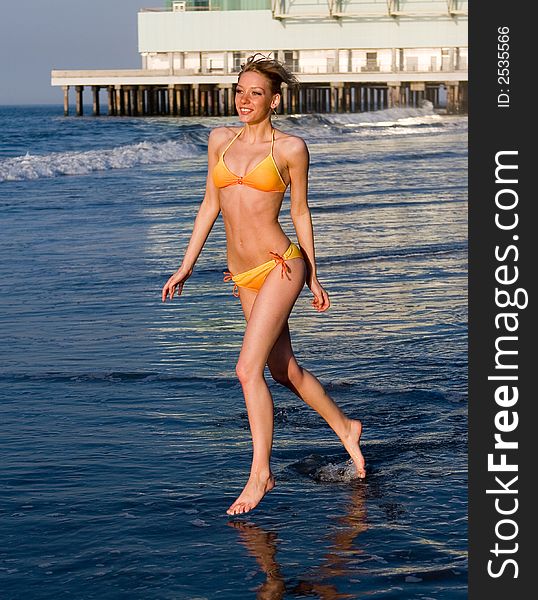 Beautiful girl running on the beach. Beautiful girl running on the beach