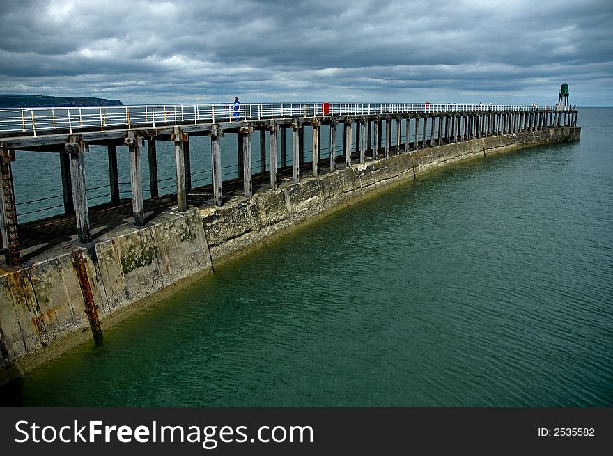 A view of whitby pier from the harbour wall