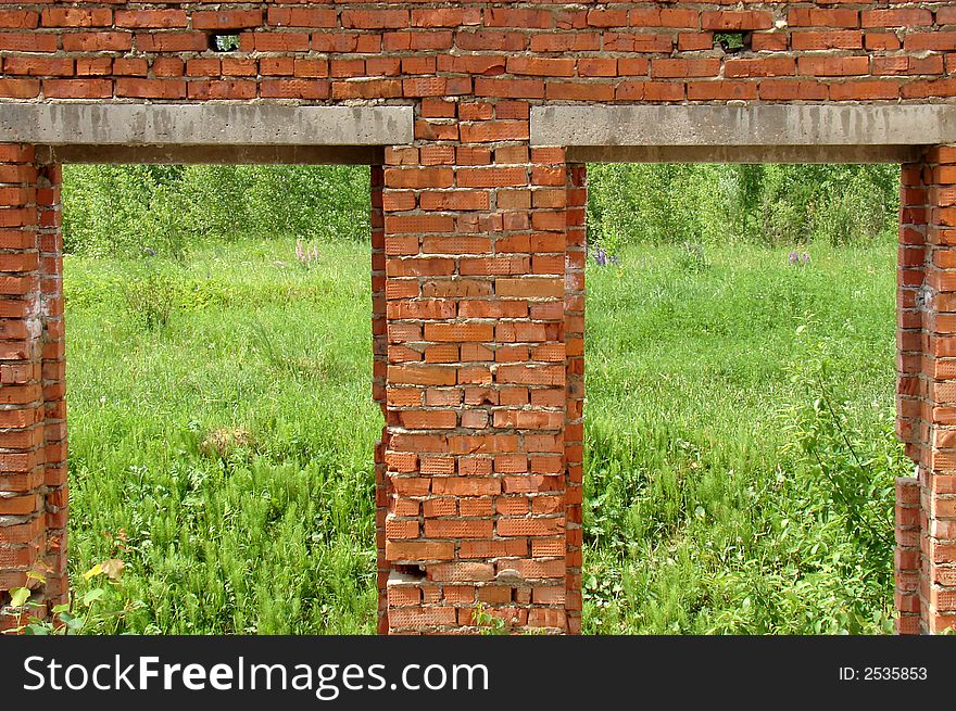 The wall with the red Bricks with two windows. The wall with the red Bricks with two windows