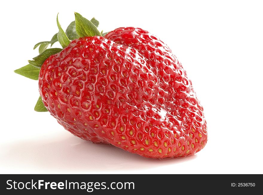 Ripe red strawberry isolated on a white background. Ripe red strawberry isolated on a white background.