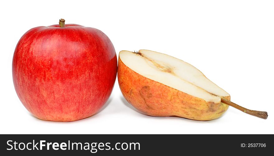 A red apple and a half of a pear over white background. A red apple and a half of a pear over white background