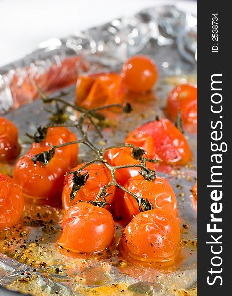 Roasted Cherry Tomatoes on the vine with olive oil, sea salt and black pepper. A delicious start to any meal.