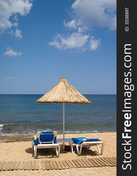 Couch and sunshade on the seaside