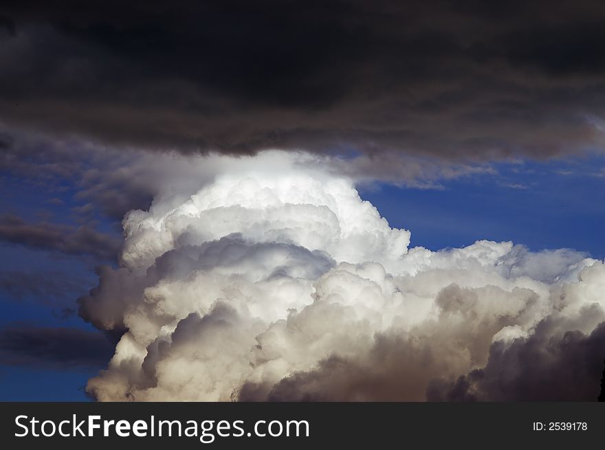 Cloudscape with dark clouds coming. Illustration of danger concept. Cloudscape with dark clouds coming. Illustration of danger concept.