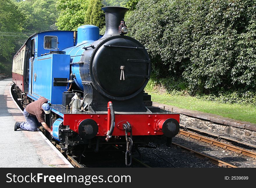 Steam locomotive being checked by the driver