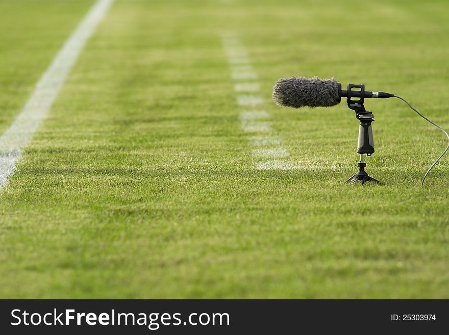 Directional microphone boom with windshield at a football stadium