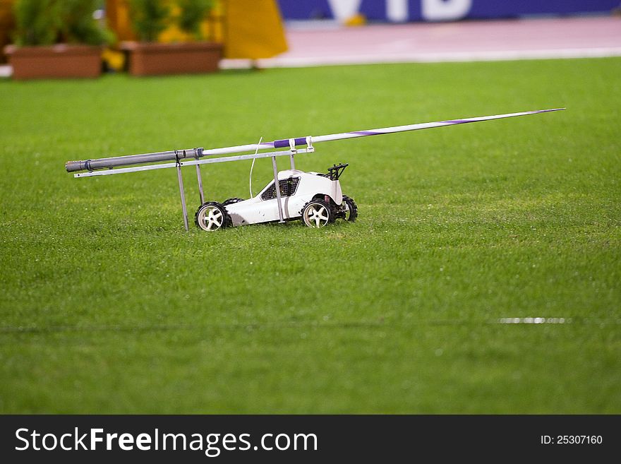 Remote controlled car in the track carrying the javelin