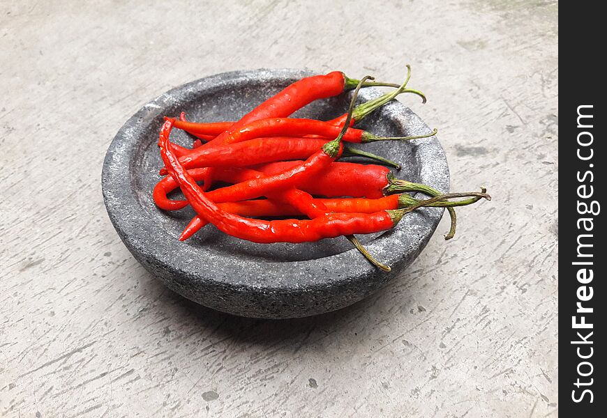 Red Big Chilli On A Stone Mortar