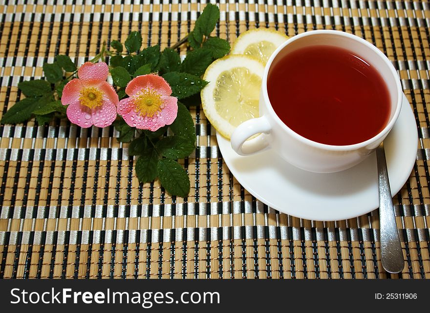 Tea with lemon and wild rose flower. Tea with lemon and wild rose flower
