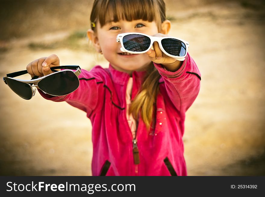 The girl near a swing on one of city parks. The girl near a swing on one of city parks