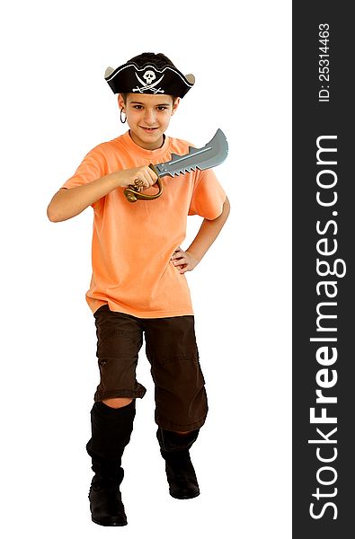 A boy dressed as a pirate with hat and boots and yataghan toy in his hand isolated on a white background