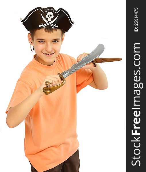 A boy dressed as a pirate with hat and boots and weapons toy in his hand isolated on a white background close up shot