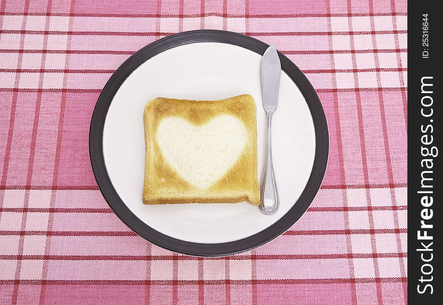 Heart-shaped toast on a dish. Heart-shaped toast on a dish