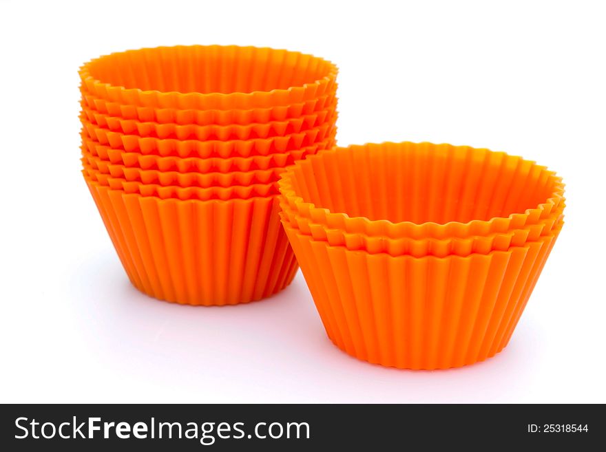 Orange silicone cupcake liners on white. Orange silicone cupcake liners on white