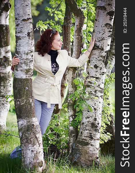 The beautiful woman embracing a birch. The beautiful woman embracing a birch