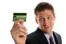 Young Businessman Holding A Credit Card Royalty Free Stock Image Young Businessman Holding A Credit Card Royalty Free Stock Image