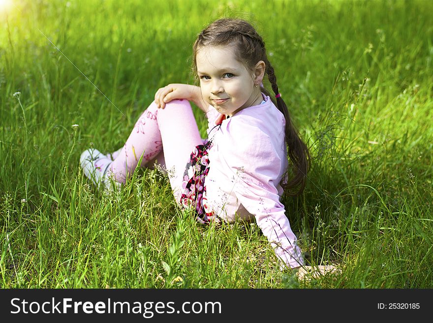 Little cute girl in park, seeting