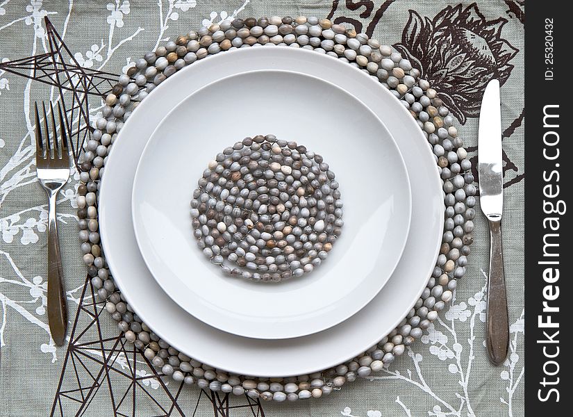 Table place setting with beaded mats