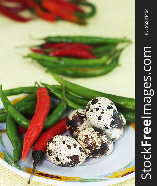 Codornis eggs and spicy red peppers