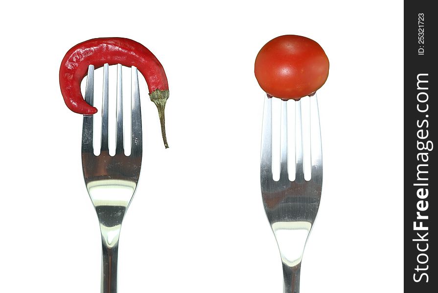 Hot peppers and cherry tomatoes hooked fork. Hot peppers and cherry tomatoes hooked fork