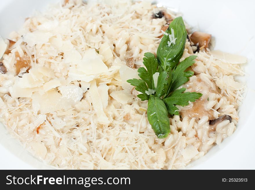 Risotto with sauce and fried mushrooms
