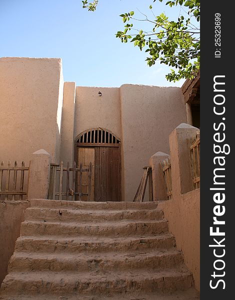 Exterior earth wall of STRAW BALE HOUSE AND EARTHEN HOUSE in Chinese ancient theme village in Dunhuang,Gansu province, China. located in rural area near Gobi desert, part of ancient silk road. Exterior earth wall of STRAW BALE HOUSE AND EARTHEN HOUSE in Chinese ancient theme village in Dunhuang,Gansu province, China. located in rural area near Gobi desert, part of ancient silk road.