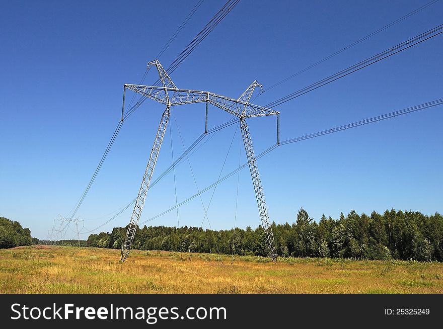 The high-voltage line running through the woods