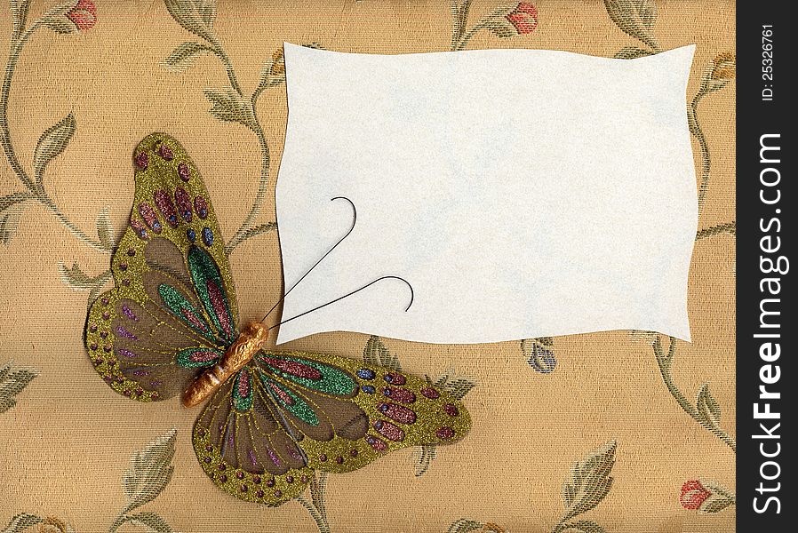 Beautiful butterfly made in fabric on texture background. Beautiful butterfly made in fabric on texture background