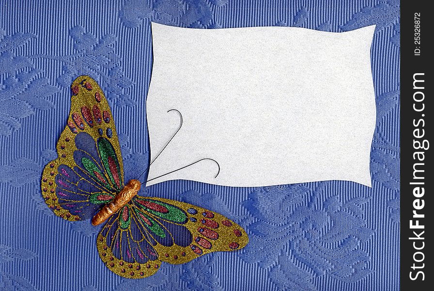 Beautiful butterfly made in fabric on texture background. Beautiful butterfly made in fabric on texture background