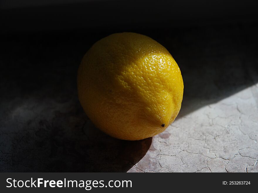 Lemon in the rays of light.