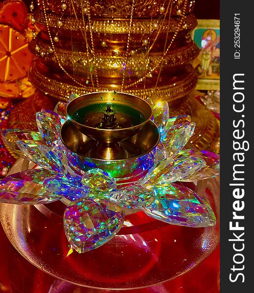 an oil lamp on a decorative stand colorful full of coconut oil gold colour lamp various chain