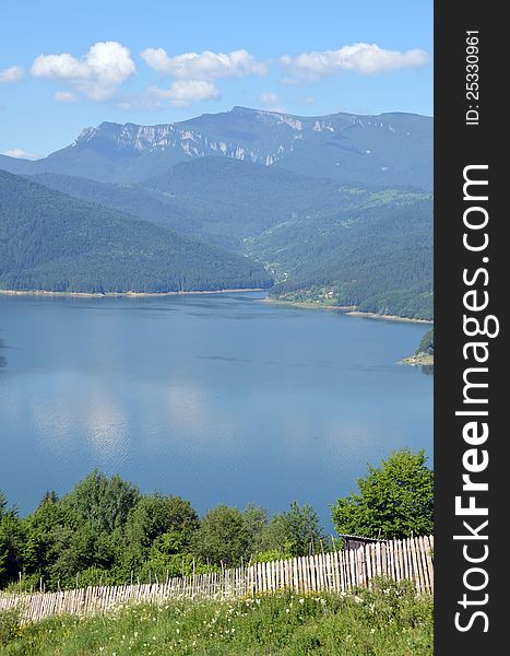 Curved bicaz lake in ceahlau mountains