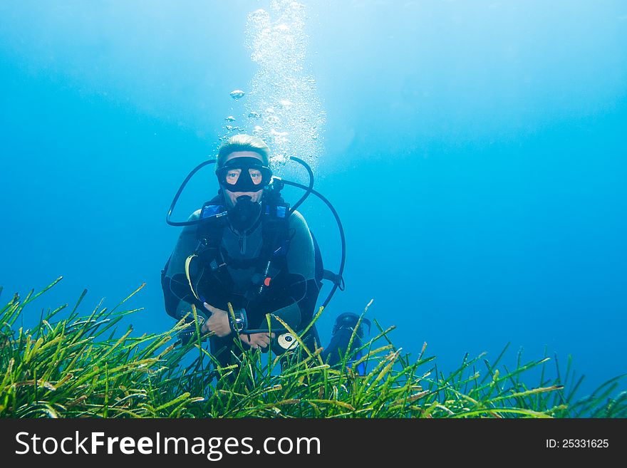 Female Scuba Diver relaxing during a dive