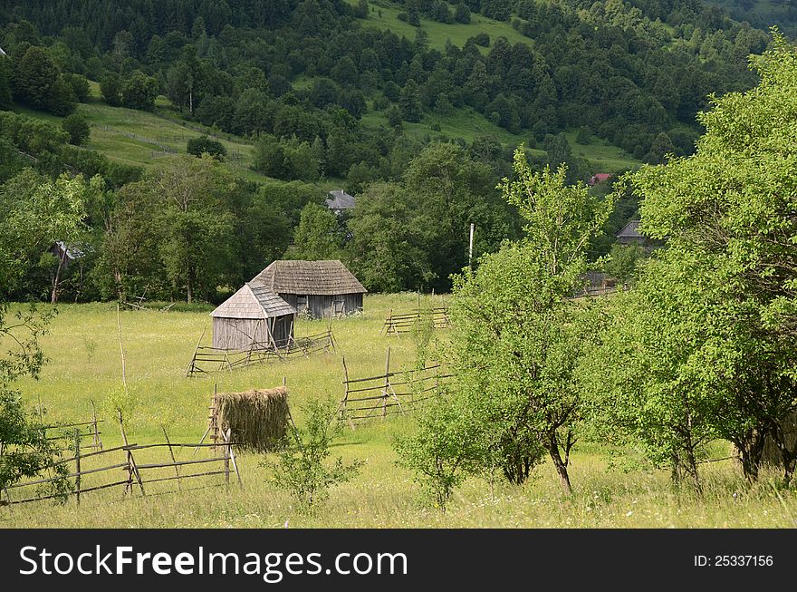 Wooden chalet on green hill and forest rural agriculture. Wooden chalet on green hill and forest rural agriculture