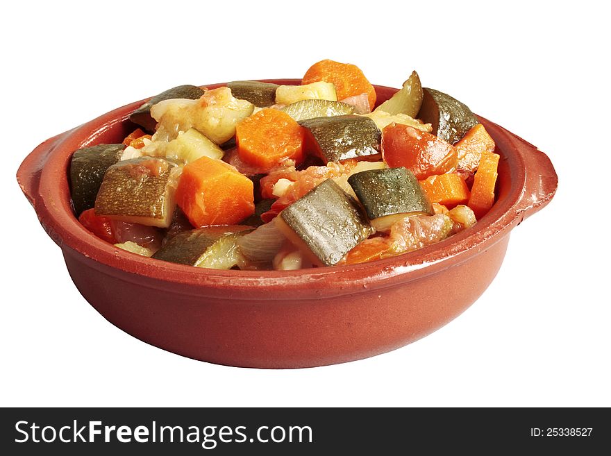 Stuffed vegetables in ceramic bowl over white background