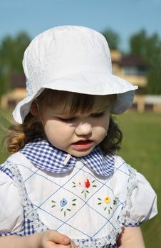 Beautiful Little Girl Looks Down Outdoor Royalty Free Stock Image